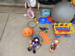 lot 117 image: Exercise ball kids Barbie trike missing 1 pedal, Frisbees, tennis balls fall dcor and more