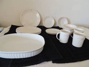 lot 126 image: Corning ware dishes 8 dinner plates, 2.5 qt.  Ovenware, 6 coffee cups, 5 saucers and 6 bowls