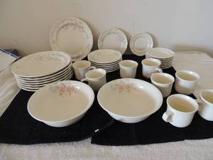 lot 127 image: Pfaltzgraff dishes- 1 salad bowl 1 soup bowl 8 dessert plates, 7 bread plates, 8 dinner plates and 8 coffee cups