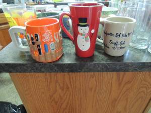 lot 125 image: Misc. lot of coffee mugs Christmas, fall and many more 6 crystal tea glasses 8 small crystal juice glasses 3 color plastic coffee cups 1 home depot coffee cup 2 papasitoes