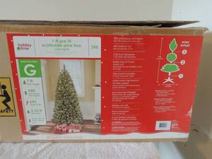 lot 14 image: 7 foot prelit Scottsdale pine Christmas Tree with clear lights in original box used only once