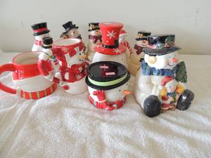 lot 19 image: Lot of Christmas coffee cups, small cookie jar, snow man lot and candle holders
