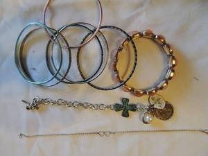 lot 197 image: Bracelets -  link chain with penny, bee,cross     silver chain with hearts and 6 bangle bracelets