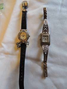 lot 199 image: Brighton watches- Silver Ashland watch with black leather band has 3 charm and Hamilton  small floral motif