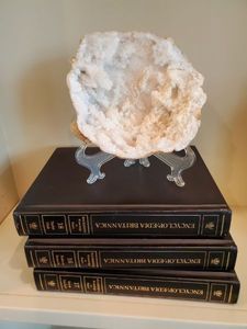 lot 21 image: Geode on Stand & 3 Encyclopedias
