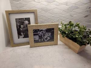 lot 36 image: 2 Dimpled Metal Frames with Faux Plant in Wood Container