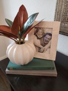 lot 28 image: Frame, Books & Faux Magnolia Flower in Vase