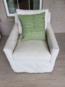 lot 66 image: Southern Oscar Outdoor  Slipcovered Chair with Pillow