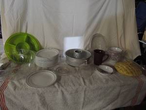 lot 45 image: 23 COMCOR   Corningware plates double black trim, Bundt pan, glass pie lid cover, 12 new Cat in the Hat bowls by Kraft Mac and cheese.
