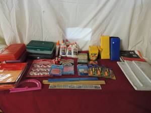 lot 58 image: School supplies- pencil boxes, pencil bags, notebook paper, spirals, erasers, pencil grips and glue