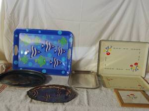 lot 62 image: Various  serving platters all sizes, silver platter says Happy Anniversary, 2 have matching flower pattern with  hotplate stand