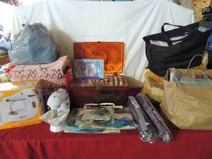 lot 68 image: Sewing lot- yard embroidery, fabric, 2 mini sewing machines, knitting  sewing box full of string