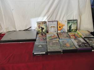 lot 70 image: RCA DVD player with lots of various DVDs some new never opened