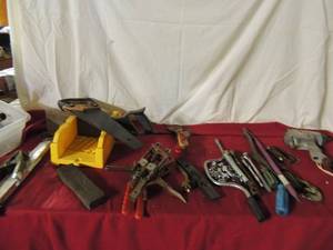 lot 79 image: Welding rods and  lead,mitor saw, various sockets and ratchets, hand saw, putty knifes and more.