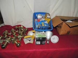 lot 83 image: Light bulbs all sizes box of door knobs all parts included