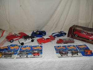 lot 113 image: 7 NIP hot wheels cars- 1957 corvette, white hummer, 1006 blue Chevy 206, 1957 Chevy, 1965 Shelby cobra 427 5c 1957 Chevy bel-air   front train car