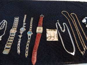 lot 115 image: Various gold and silver necklaces, queen Corel watch by quartz 2, linked dolphin watches and more
