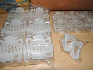 lot 126 image: Box  full of new in box white hair clips jumbo-small and baby foot shaped over 50