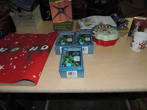 lot 127 image: Christmas lot- LED lights Nib Santa cookie tin Christmas gift bags tree stand and more