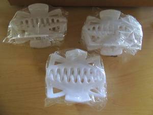 lot 128 image: Box of white  jumbo hair clips NIP