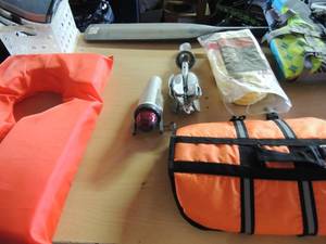 lot 130 image: Boating lot- anchor and rope new, 2 lifejackets, 1 kid and a dog life jacket, boat light and oar
