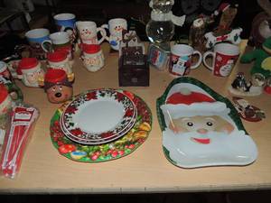lot 132 image: Christmas lot- coffee mugs, 2 snowmen cups, plates, snow globes , music box, singing stuffed animals and much more
