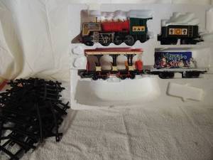 lot 36 image: Christmas train set. Tracks included but missing 2 cars