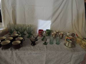 lot 37 image: Large lot of cups- M&M mugs, Kahlua cups, coca cola glasses, wheat cup and more