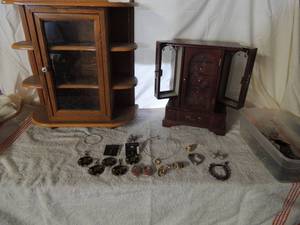 lot 38 image: 2 Large jewlery boxes. Included various costume jewlery, earrings, all shapes and sizes colors, necklaces and chokers.