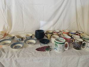 lot 39 image: Blue and white dishes- 2 hat tea cups, creamer,3 soup bowls, 11 Homer Fiesta dessert bowls Forrest green. Large lot of  home & Gardens coffee cups
