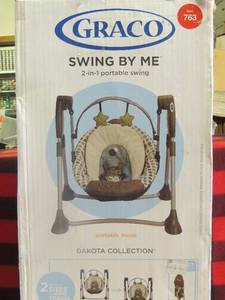 lot 170 image: Used Graco baby swing in original box  can be used as  2 different  sizes