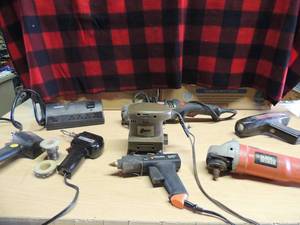 lot 209 image: Soldering guns  X 2,   B&D grinder 120 volt,   Cummings sander 110 volt   B&D hot glue gun   AC power timing light   craftsman grinder   Phillips electric plug 6 outlets
