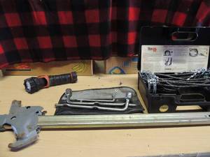 lot 223 image: Jack, tire tool for lugs flashlight cable chair installation and removal