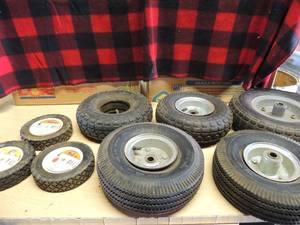 lot 233 image: Push mower tires x 3 size  15.2 cm  Plastic wheels power core brand 5 riding mower tires sizes vary 4.10 3.50-4 1 large 4.00-G tire blown
