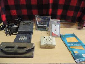lot 242 image: 2 credit card machines, hole punch, 6x9 brown envelopes   shock resistant circuit lug surge protector