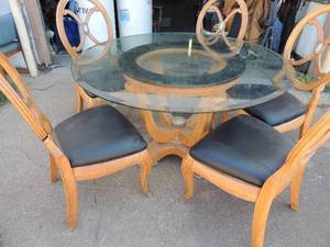 lot 4 image: Very nice large glass top kitchen table with 5 chairs solid wood chairs have claw feet   - 53  12 round 30 tall.   chairs 42  12 tall brown and black