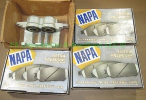 lot 42 image: Ford brake caliper 6W1Z-2B121-AA and NAPA disc brake pads, all never used in original boxes
