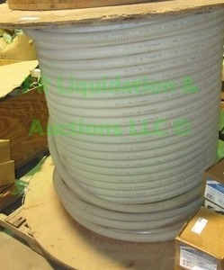 lot 325 image: Corrugated tubing with cable inside large roll