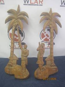 lot 109 image: TOTAL OF 2 HAND CARVED WOOD&nbsp ART WALL DECOR&nbsp MAN &amp WOMAN PICKING COCONUTS FROM PALM TREE&nbsp