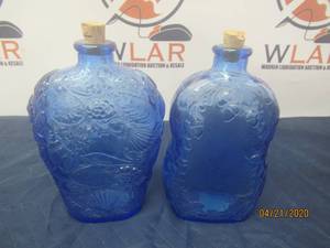 lot 125 image: TOTAL OF 2 COLLECTIBLE VINTAGE COBALT BLUE PRESSED GLASS ACORNS &amp OAK LEAVES DESIGN BOTTLES&nbsp