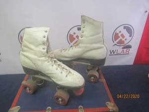 lot 176 image: PAIR OF VINTAGE ROLLER SKATES