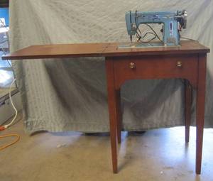 lot 632 image: Montgomery Wards sewing machine is cabinet