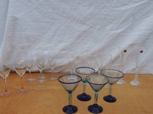 lot 144 image: 6 wine glasses, 4 pecan plantation wine glasses, 4 blue martini glasses, 2 orange stemmed wine glasses, 2 millennium long-stemmed wine glasses
