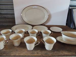 lot 155 image: Lenox Solitaire dish set- 16 dessert plates, 8 salad plates, 7 dinner plates, 1 large platter, 8 tea cups, all have silver trim 1 soup terrain and 8 bread plates  40PCS