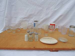 lot 139 image: lot-Prego with top, 3 roller orange juice containers x 1 doz., 4 double shot glasses, 3 set of S&P shakers, ashtray, anchor measuring glass, valentine mug, white coffee mug, sugar container and vase