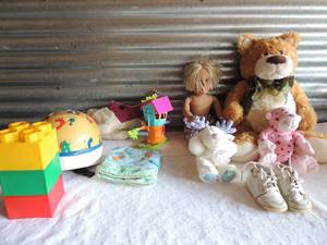 lot 185 image: Childrens toys- stuffed animals, bike helmet, stackable bricks x 3 and boys toddler walker