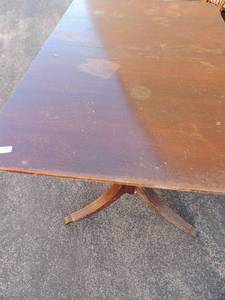 lot 218 image: DUNCAN PHYFFE Dining room table no chairs 1 leg needs to be fixed. 29 H x 60 L x 40 w