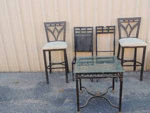 lot 220 image: Metal side table with glass top (corner chipped)23 x 22 x 48    2 black metal chairs ,   2 tall bar chairs 43H   black and cream cola seats
