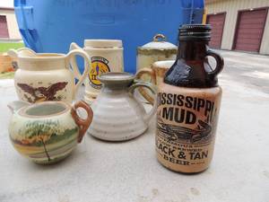 lot 241 image: Mississippi mud beer bottle 1 pint 1996 hand painted Nippon chia tea pot American eagle milk pitcher Susan wirget Gaelic dcor coffee mug Air force gold trim mug and more