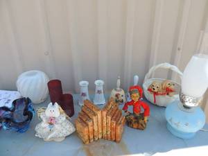 lot 22 image: Sunpot with 2 dogs on the side, 2 liberty bells, blue blown glass ashtrays, 2 bookends (pair) blue oillamp and more